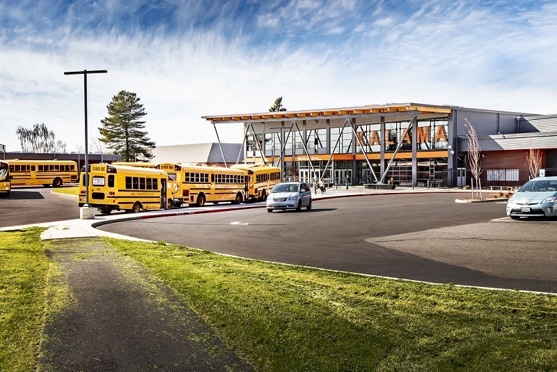 Kalama Middle School with buses parked out front